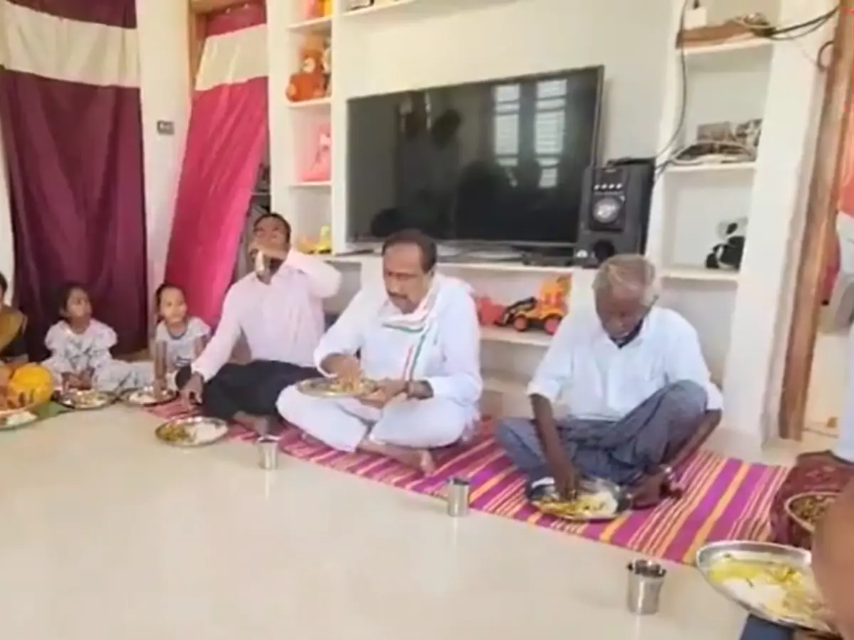 BRS MLA Sanjay Kumar dined at the home of a rice beneficiary wearing a Congress scarf