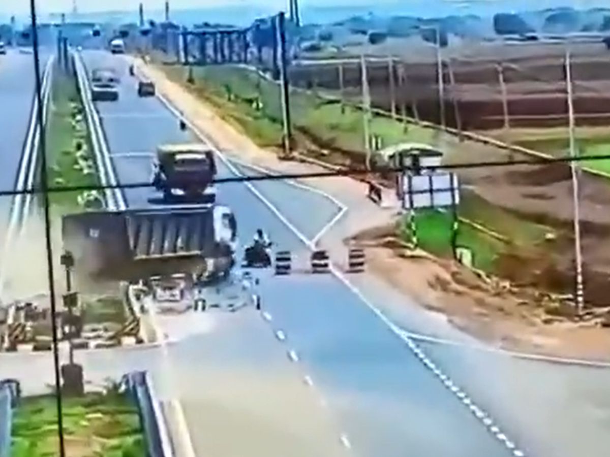 A serious road accident in AP  Tipper rammed into a bike due to a mishap Motorists seriously injured